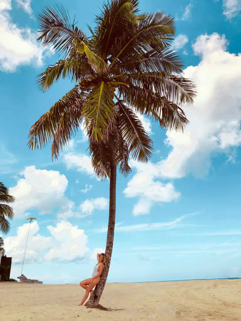 Girl on palm tree