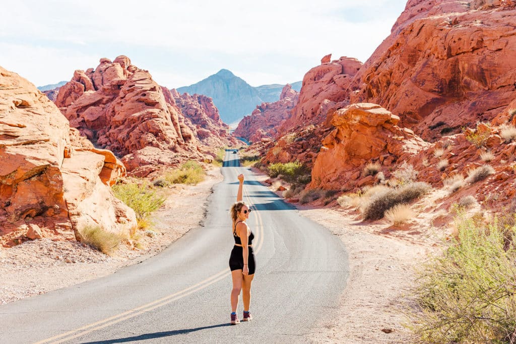girl standing in the middle of Mousetank Road, Valley of Fire