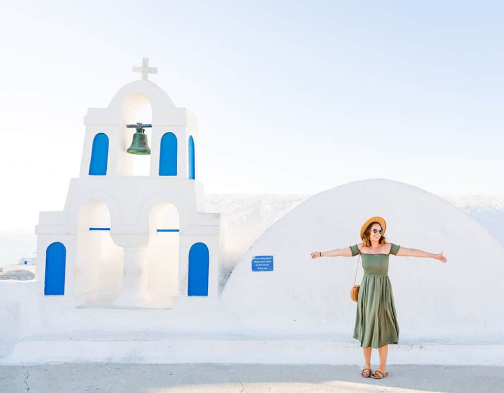 girl in dress in front of Greek church