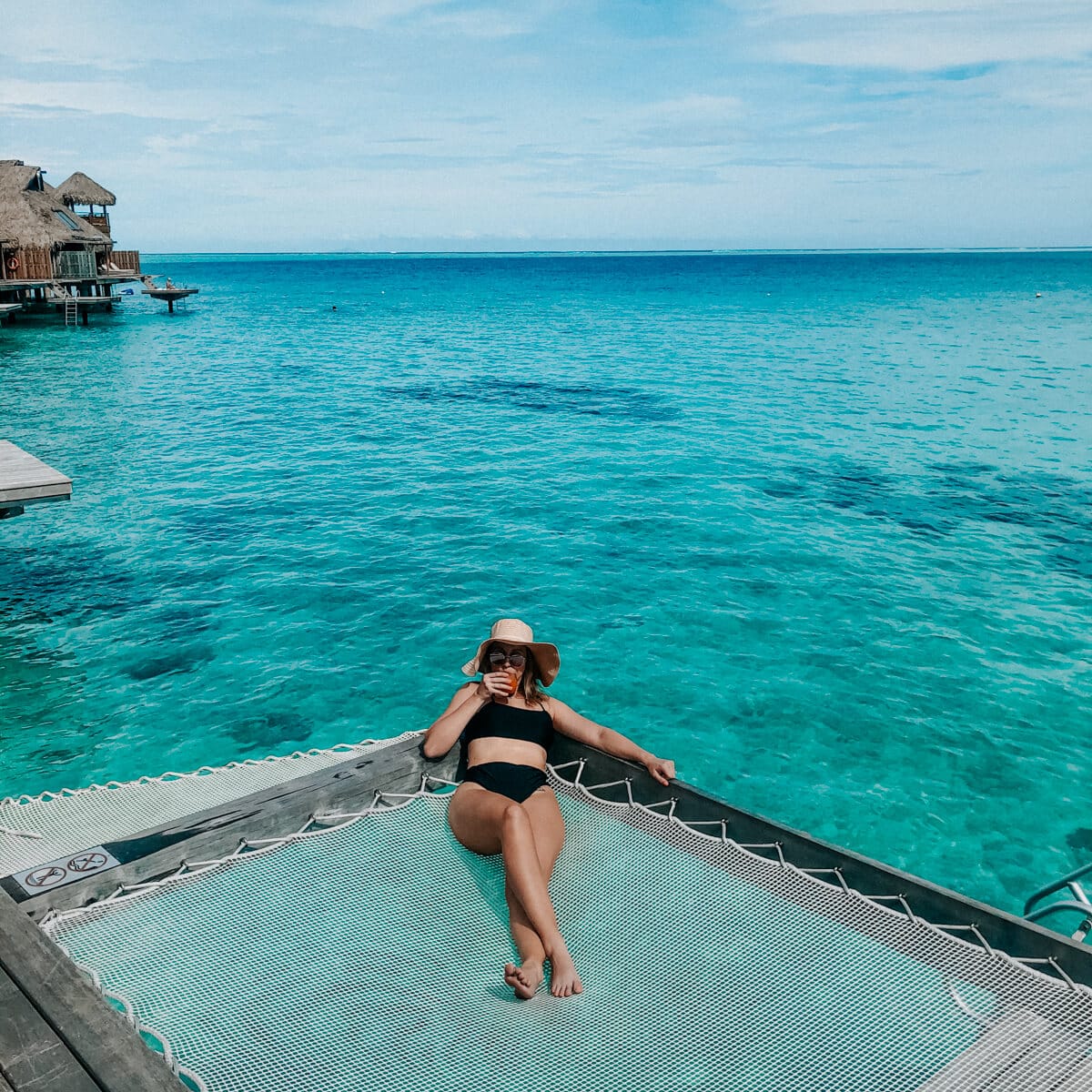 girl sitting on hammock in Bora Bora
