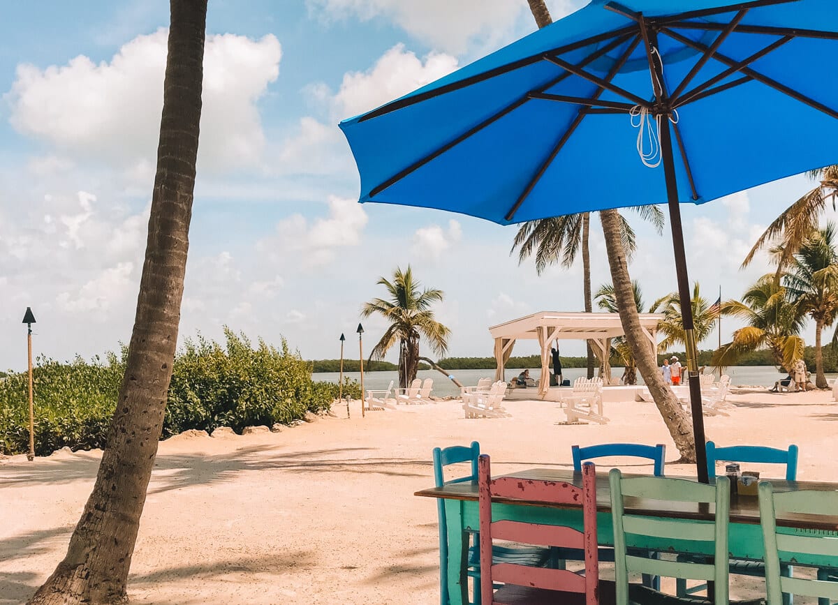 Colorful table with blue umbrella in Islamorada, Florida