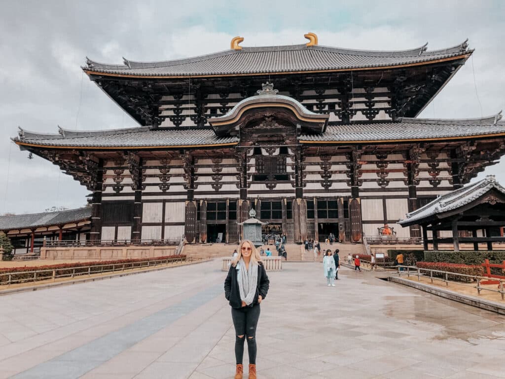 Girl standing in front of temple in Nara Japan