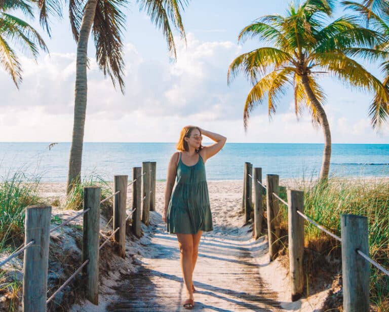 girl standing on beach boardwalk in Keys