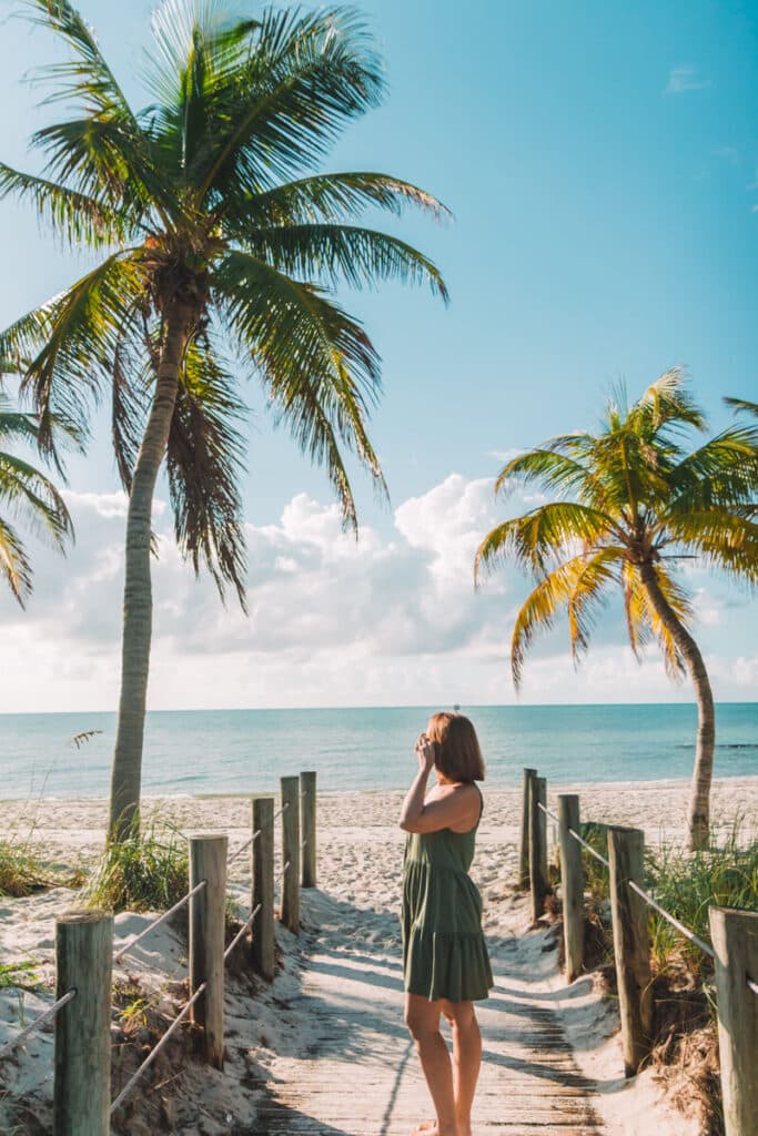 girl on Smathers beach board walk in Key West
