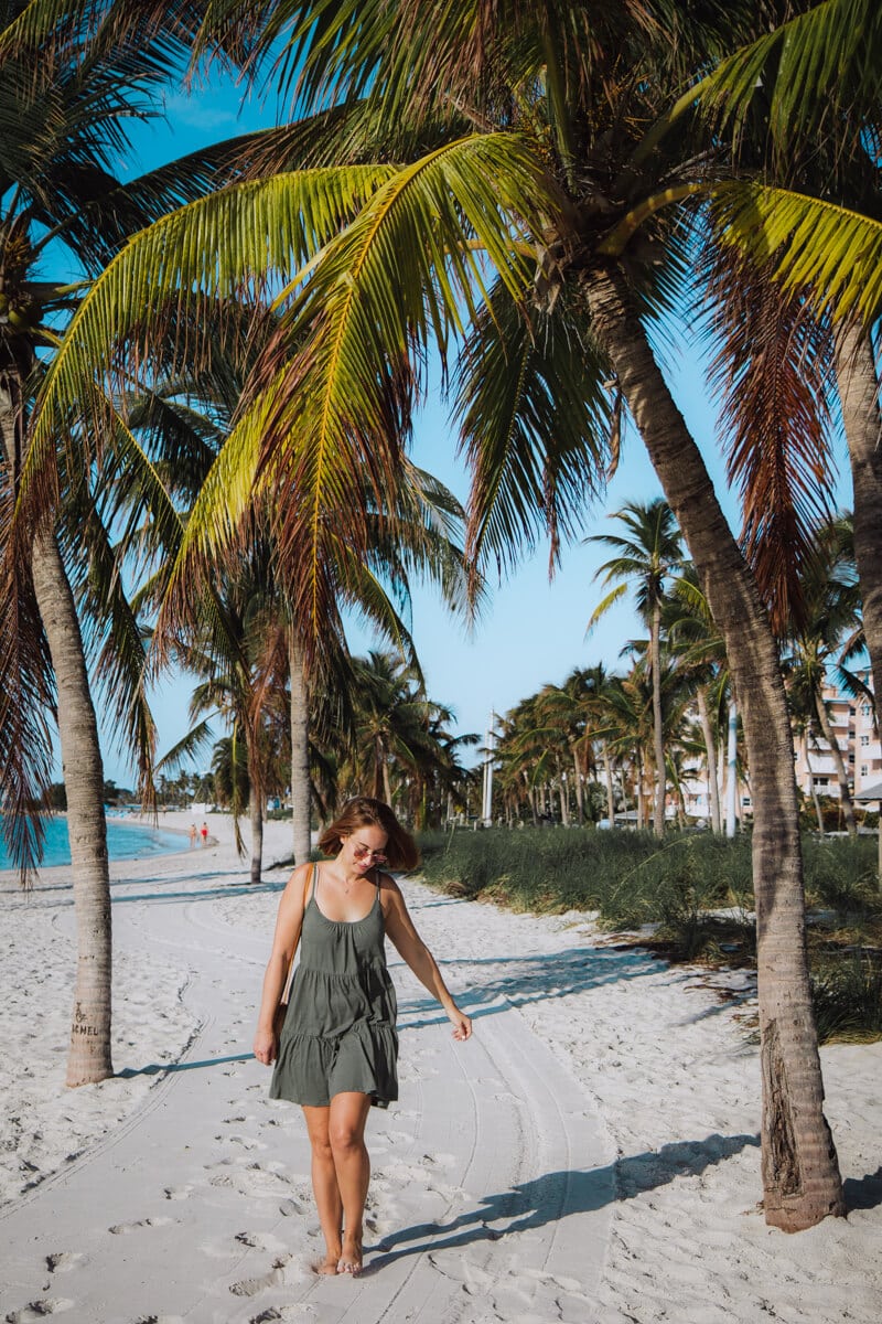 girl walking on Smathers beach in Key West