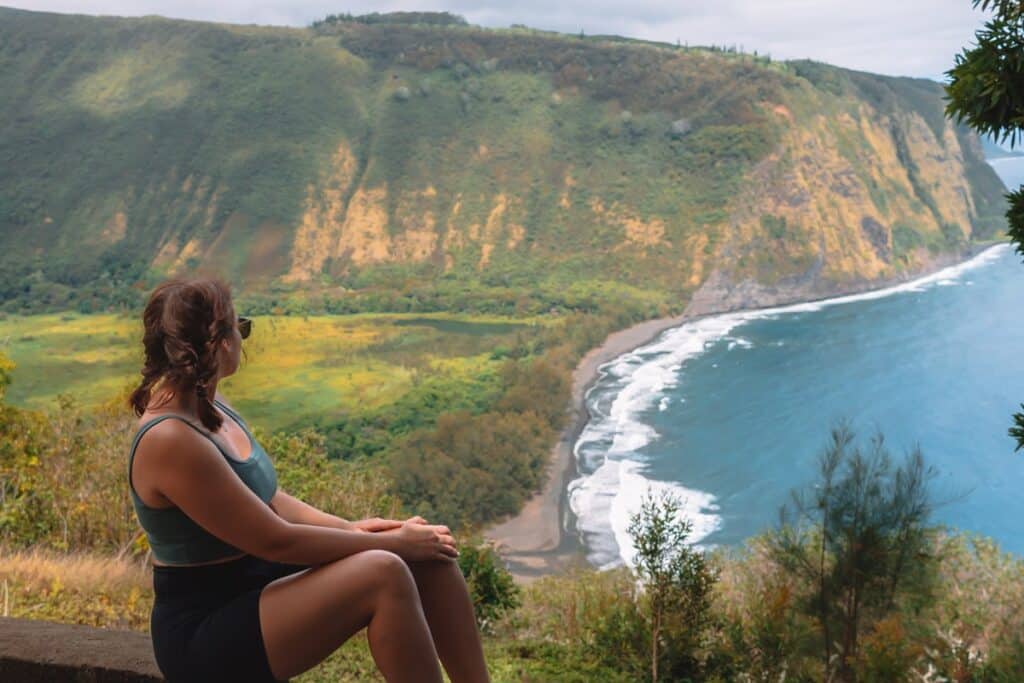 girl overlooking Waipio Valley Hawaii