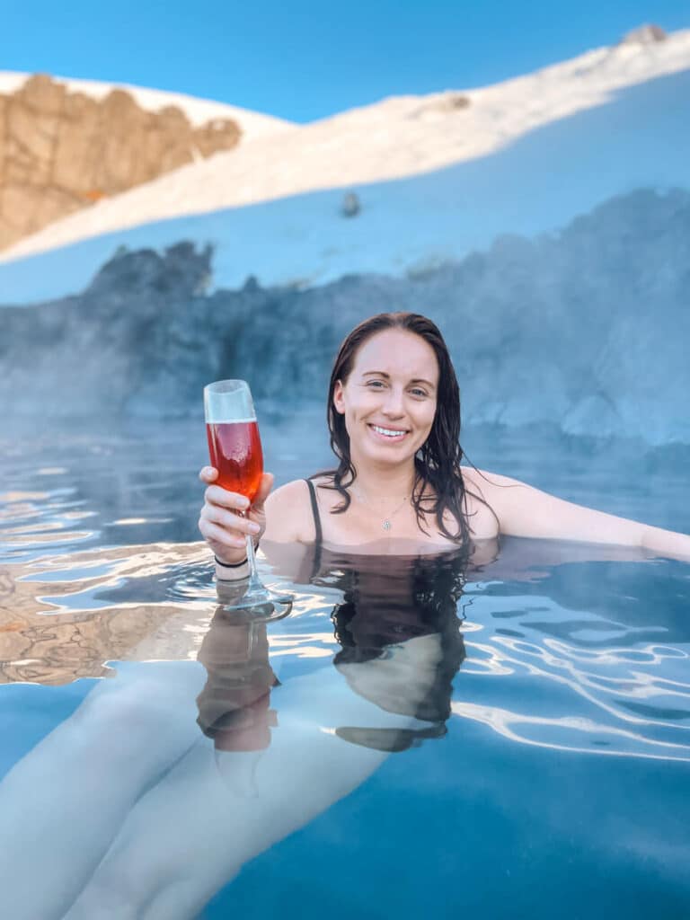 girl sitting in water at Sky Lagoon Iceland