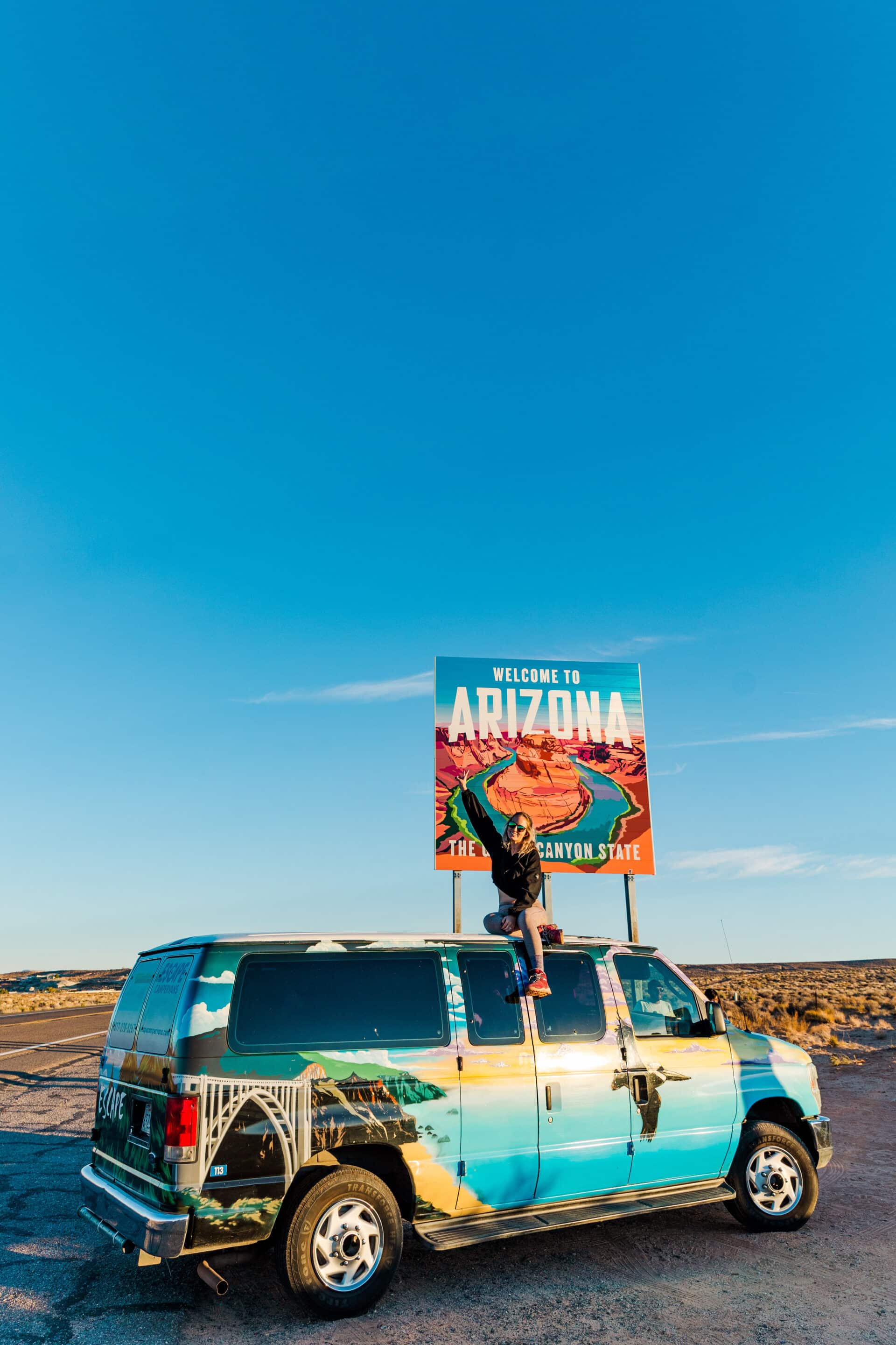girl on top of van in Arizona