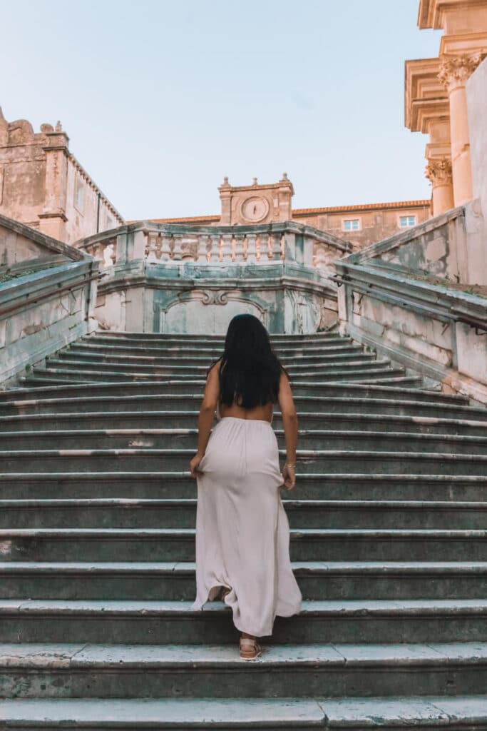 girl walking up Jesuit stairs from Game of Thrones in Dubrovnik, Croatia