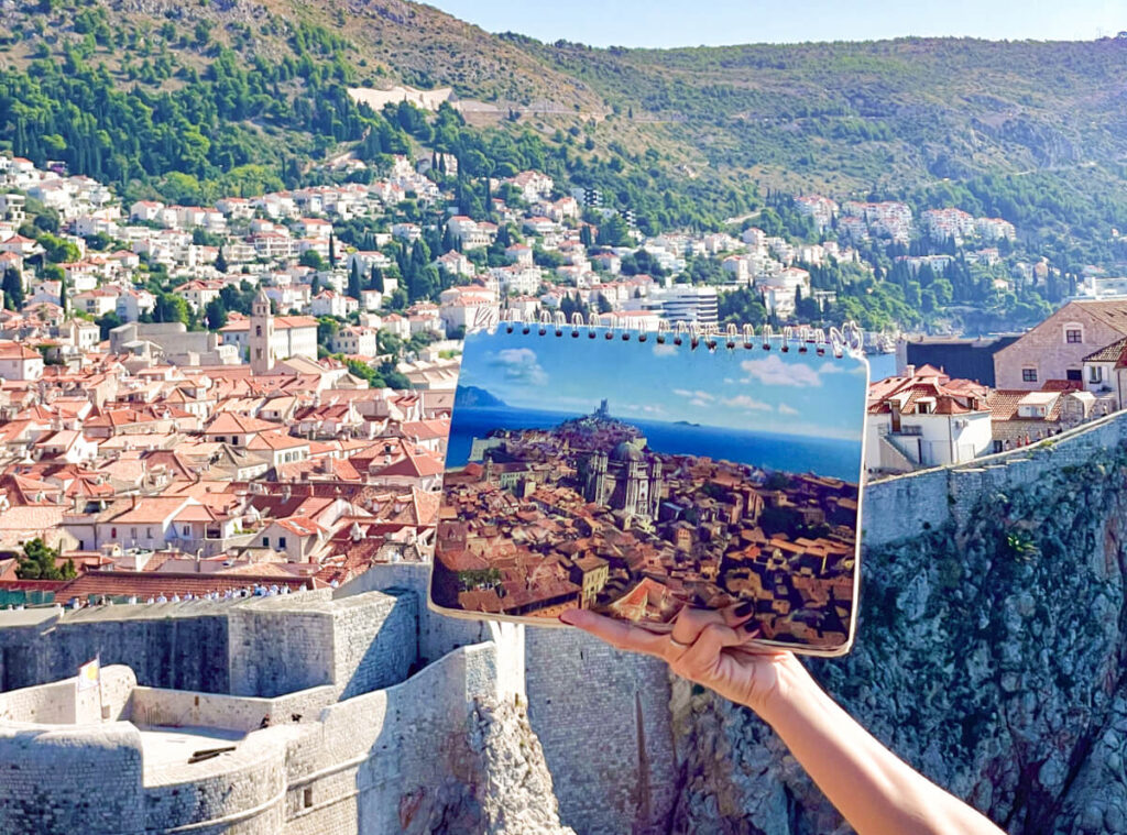 Game of Thrones flip book in front of Dubrovnik