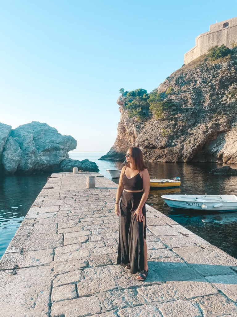 girl standing in West Harbor, Dubrovnik, Croatia