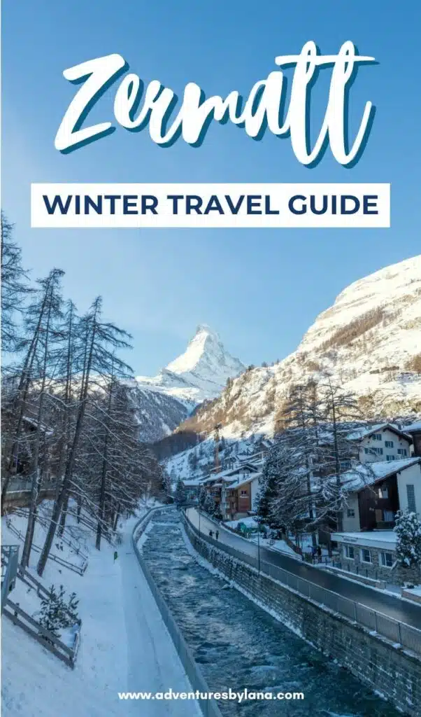 A scenic winter view of Zermatt with a clear river running through the snowy village and the Matterhorn towering in the background. Text overlay reads “Zermatt Winter Travel Guide” with adventuresbylana.com at the bottom.