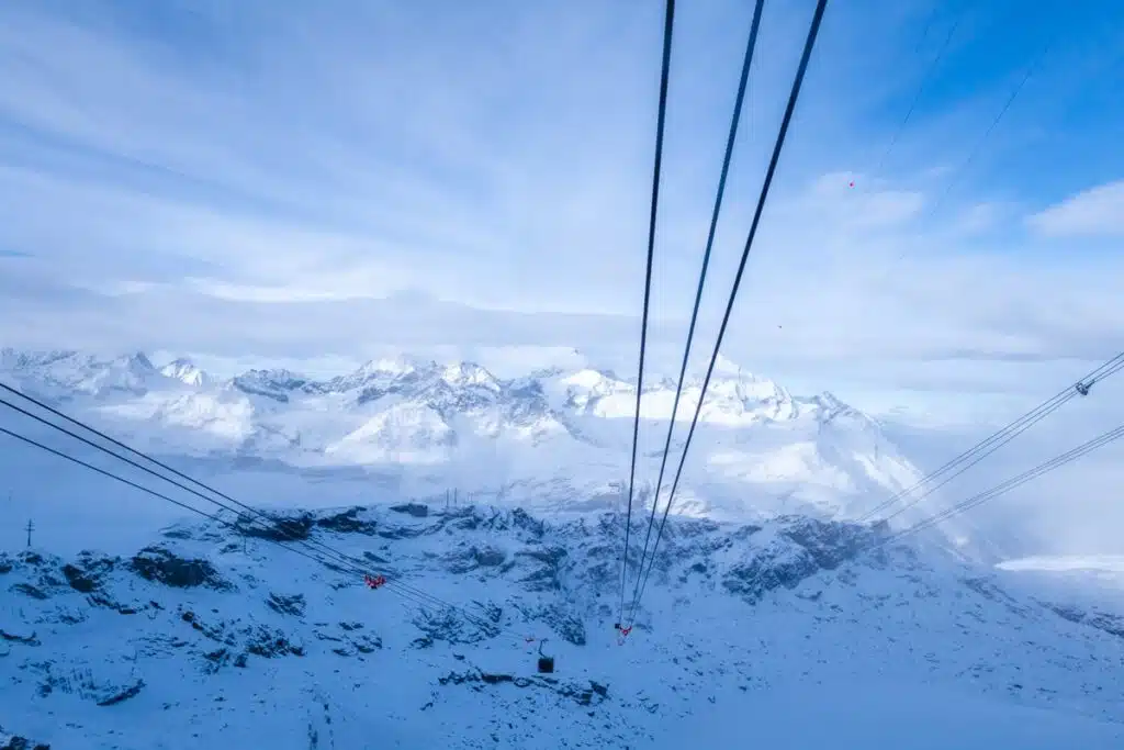 three runs of cables going down into Zermatt on the Matterhorn Glacier Paradise
