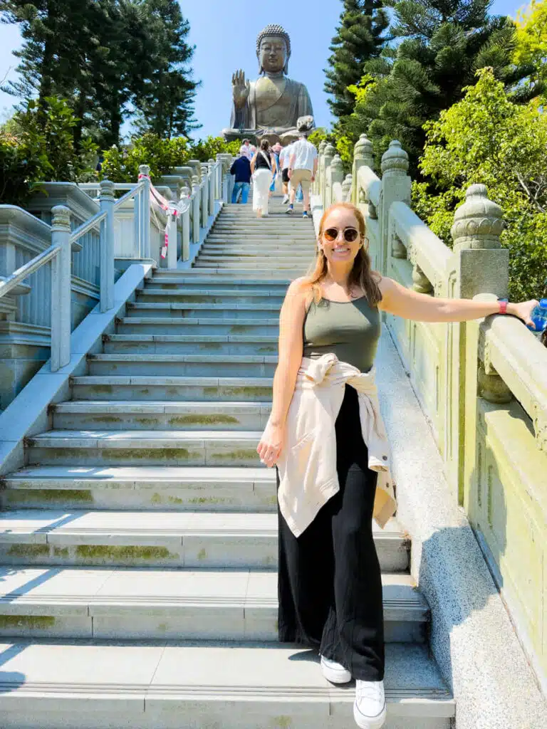 girl on stairs in front of Big Buddha Hong Kong