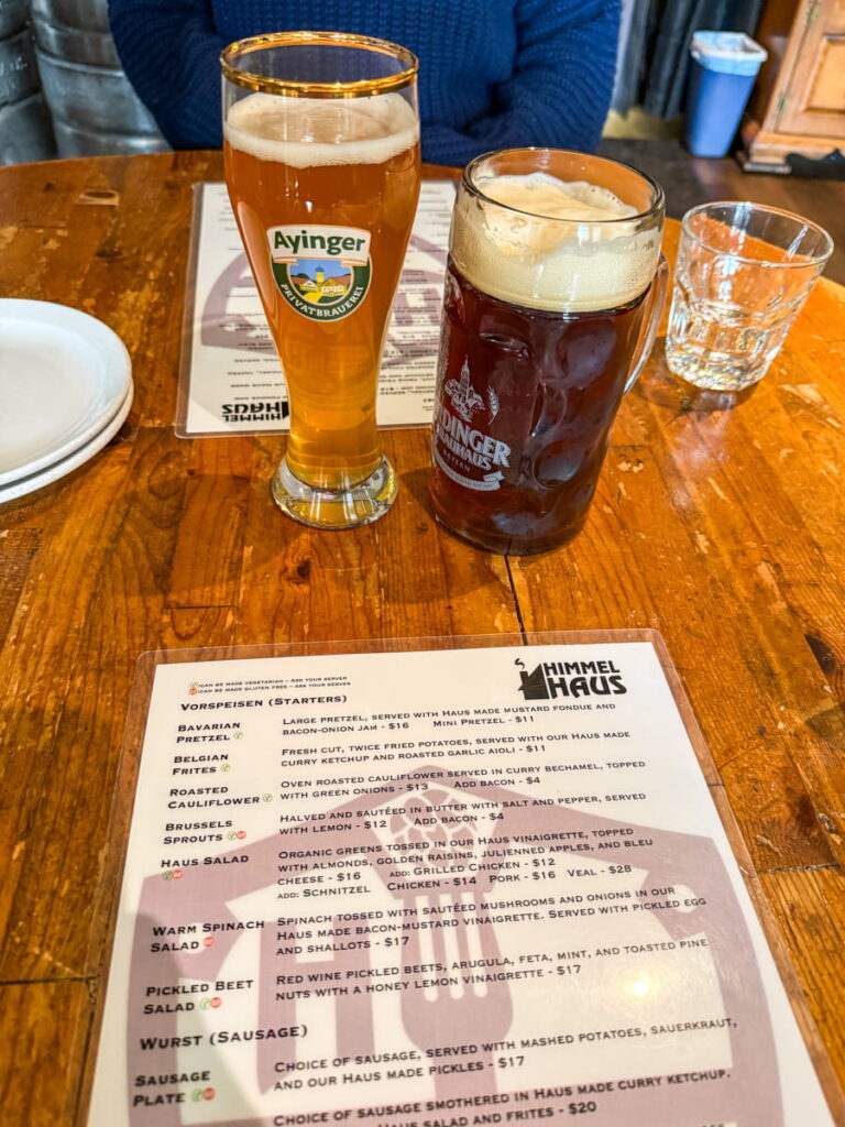 menu and two German beers on wooden table taken at the Himmel Haus Restaurant in Lake Tahoe