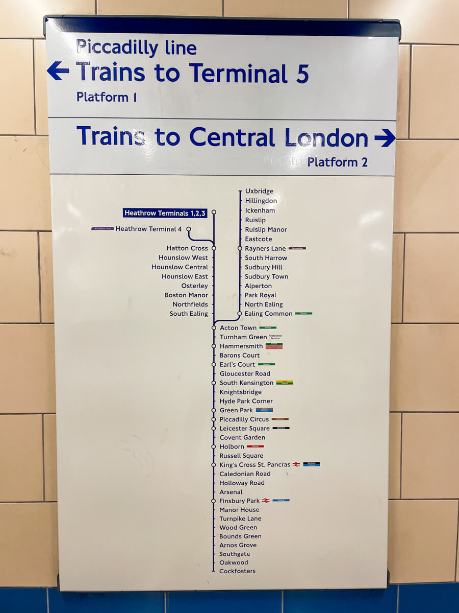 Piccadilly line platform sign at Heathrow showing trains to Central London, with stops including Knightsbridge, Piccadilly Circus, Leicester Square and Covent Garden
