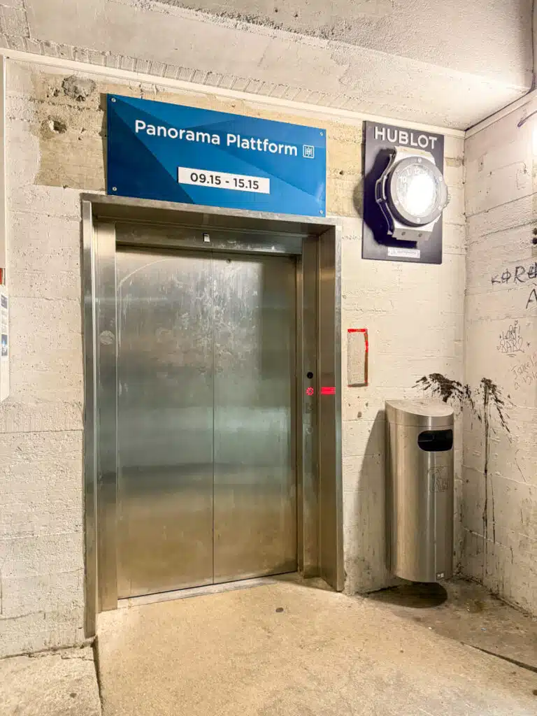 elevator entry with blue a sign above it that reads Panorama Platform, taken inside the Matterhorn Glacier Paradise